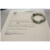 Image 3 : ONE ELASTICISED BRACELET OF 16 PALE GREEN JADE BEADS.  APPROX. 19CM LONG.  REPLACEMENT VALUE: