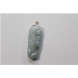 1 ELONGATED OVAL SHAPED CARVED NATURAL BURMESE JADEITE PENDANT CARVED IN THE SHAPE OF A DOMED AND