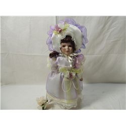 13" PORCELAIN DOLL IN PURPLE DRESS