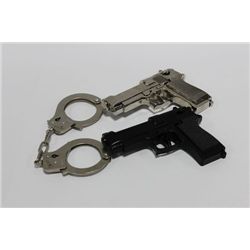 BOX W/ 2 GUN BELT BUCKLES & 1 SET OF HANDCUFFS