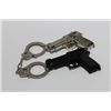Image 1 : BOX W/ 2 GUN BELT BUCKLES & 1 SET OF HANDCUFFS