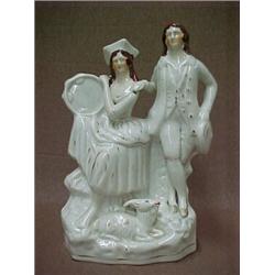 Staffordshire double figurine, seated woman with tambourine and standing man, goat at their feet,...