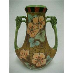 Nippon enameled handled vase, hand painted with polychrome floral design on body of vase, black e...