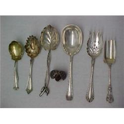 One lot of six sterling silver flatware serving pieces and a sterling silver nutmeg shaker includ...