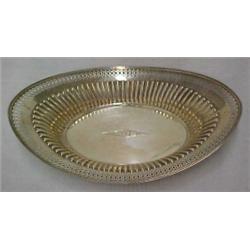 Sterling silver bread basket, reticulated banding around rim over fluted decoration, flat bottom...