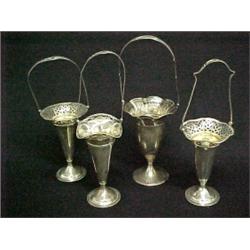 Four sterling silver baskets, all with reticulated rims and interior gold wash, all with the same...