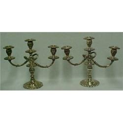 A pair of sterling silver weighted triple candleholders, chased floral and swirl design, removeab...