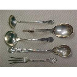 One lot of sterling silver flatware serving pieces including George Jensen sauce ladle; Baker-Man...