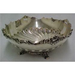 Sterling silver round serving bowl, chased rim design over chased fluting, on round base with fou...