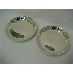 A pair of round sterling silver cake or pie stands, fluted edge, center initials, each on round p...