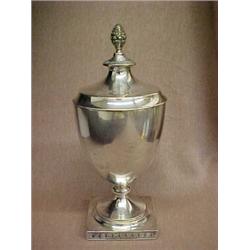 800 silver tea caddy, pineapple finial on round lid, urn shaped form on square base, both with in...
