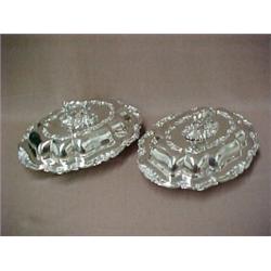 A pair of Sheffield entree dishes with lids, shell and leaf rim decoration, engraved shield on si...