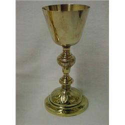 Sterling silver chalise with gold wash, chased decoration on baluster shaped stem and base, 9" h....
