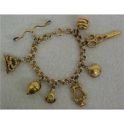 14K gold charm bracelet with gold and gold filled charms, 14K gold charm bracelet with gold fille...