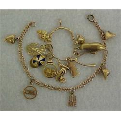 14K gold charm bracelet and charm holder with charms, rose gold bracelet with five gold charms, w...