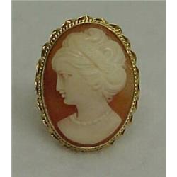 14K gold cameo ring, carved shell cameo measuring one inch in length, surrounded by 14K gold beze...