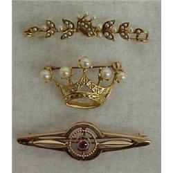 Three gold bar pins, 10K rose gold Art Deco pin with pink stone 1 3/4" in length; 14K yellow gold...
