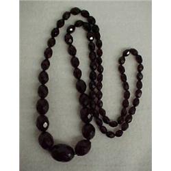 Cherry amber bead necklace, 30" strand of graduated faceted cherry amber beads Estimate 150/20...