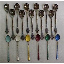 Two sets of silver enameled demi-tasse spoons, one set of six sterling silver spoons, each decora...