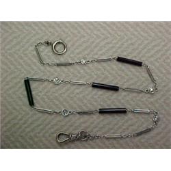 Platinum, diamond and black onyx watch chain, thirteen inch chain with five collet set diamonds a...