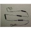 Platinum, diamond and black onyx watch chain, thirteen inch chain with five collet set diamonds a...