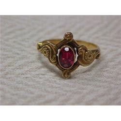 Art Nouveau 14K gold and garnet ring, oval shaped garnet in fancy 14K yellow gold setting, approx...