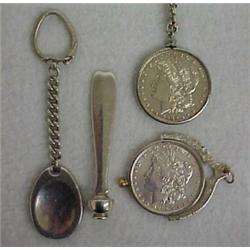 Tiffany sterling silver key chain and cigar tamper and two silver dollars, sterling silver key ch...