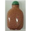 Image 1 : Goldstone snuff bottle, 2 3/4" high, undecorated carved goldstone with green stone stopper, with...