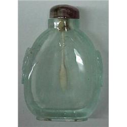 Aquamarine snuff bottle with carved sides, decorated with masks and rings, 2 1/2" high includes p...