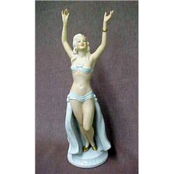 Art Deco porcelain figure of a woman with upswept arms, marked on bottom Schaubach Kunst Germany,...