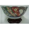 Image 2 : Imari bowl on wooden stand, scalloped rim with undulating design, interior center Chinese script,...