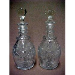 A pair of hand cut crystal decanters, ringed design on neck, diamond and line cut on body, Englis...