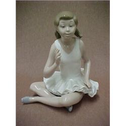 Nao figurine made by Lladro, seated ballerina, 6" high (division of Lladro) Estimate 50/100...