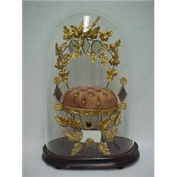 Victorian gilt ormolu and pink silk upholstered memorial stand, gilt bird with wreath in mouth, a...