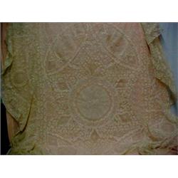 A pair of lace twin bed covers with floral design, with the original pair of apricot floral under...