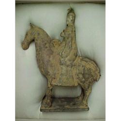 Pottery statuette of a lady on horseback with a drum, unglazed with remains of original black and...