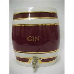 Porcelain gin dispenser in oval form, maroon and gilt on white ground, "GTN" on front and back, r...