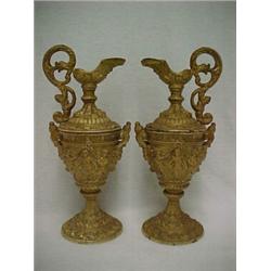 A pair of painted spelter ewers, mask on bottom of spout, dolphin and mermaid handle, raised figu...