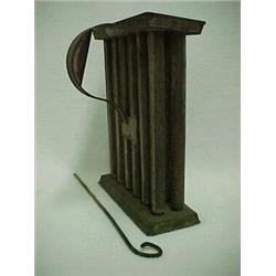 Tin candle mold, twelve tubes, C shaped handle, with rod, 10 1/2" high Estimate 100/200...