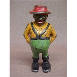 "Sharecropper" cast iron bank with hole in shoe, mfg. by A. C. Williams of Ravenna, Ohio, patente...