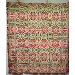 Woven coverlet on Jacquard loom, applied fringe, mid 19th C., in green, red, and yellow, floral m...