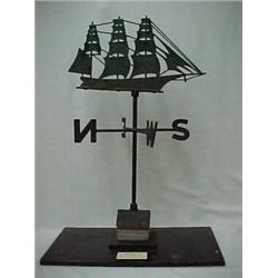 Sheet iron ship's weathervane on wooden "house", mounted on board, C.1910, 32" high Estimate 9...