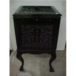 Rosewood Chinese Chippendale temple jar on stand, carved panel on top with raised dragon head han...