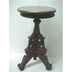Walnut Victorian plant stand with round brown beveled marbletop, on turned standard with three st...