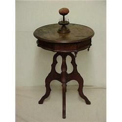 Walnut puzzle top sewing stand, hinged puzzle piece on round top lifts to expose rotating compart...