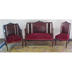 Three piece French Victorian inlaid parlor set consisting of settee, armchair, and side chair, al...