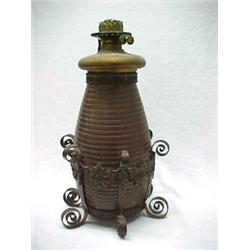 Oil lamp with brass font, sits in brass urn with beehive form, Greek key and bead decoration arou...