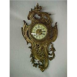 French Cartel clock in bronze case, enameled dial, 22" high Estimate 600/1000...