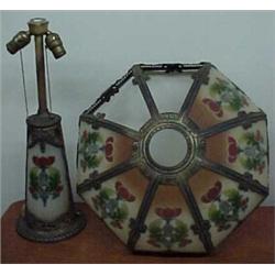 Spelter lamp with two reverse painted glass panels, with matching shade with six reverse painted...