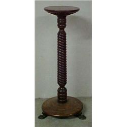 Walnut pedestal, rope turned standard on round base with three brass paw feet, measures 30" high<...